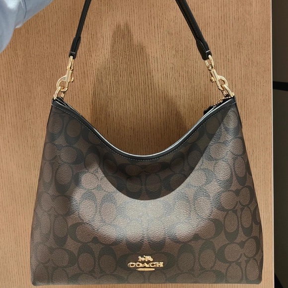 Brand new Coach black and brown monogrammed crossbody bag. - Picture 1 of 9
